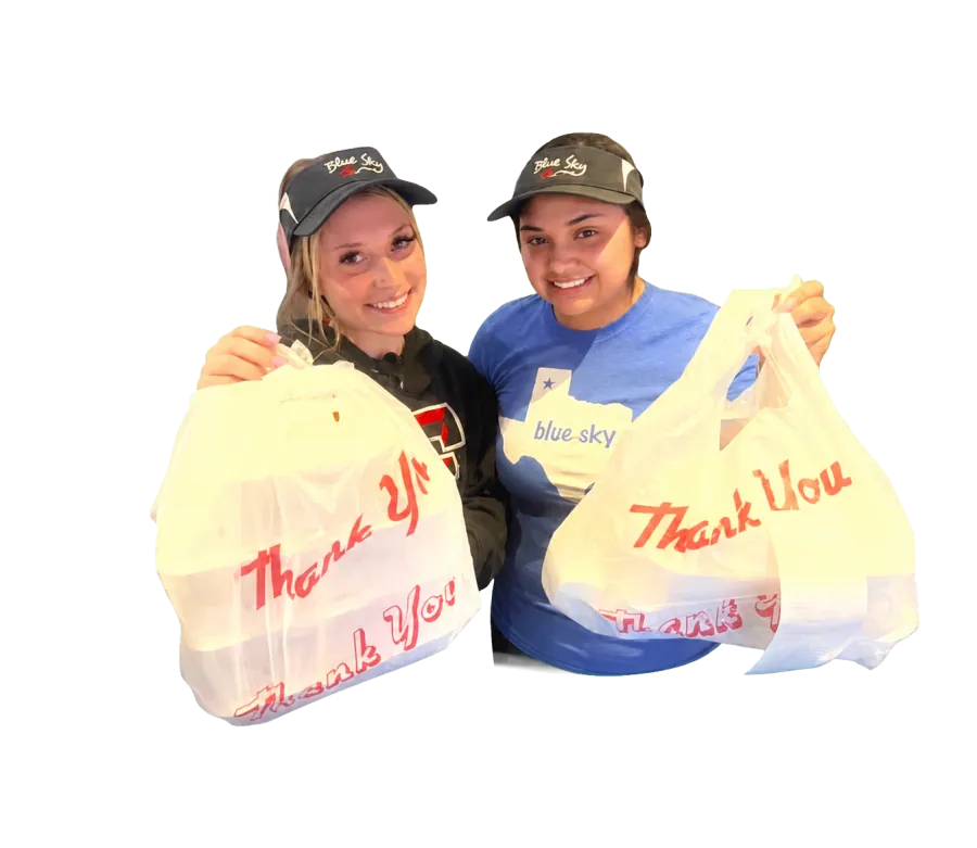 Blue Sky team members holding to-go orders